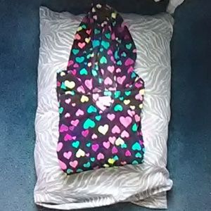 A multicolored heart sweater